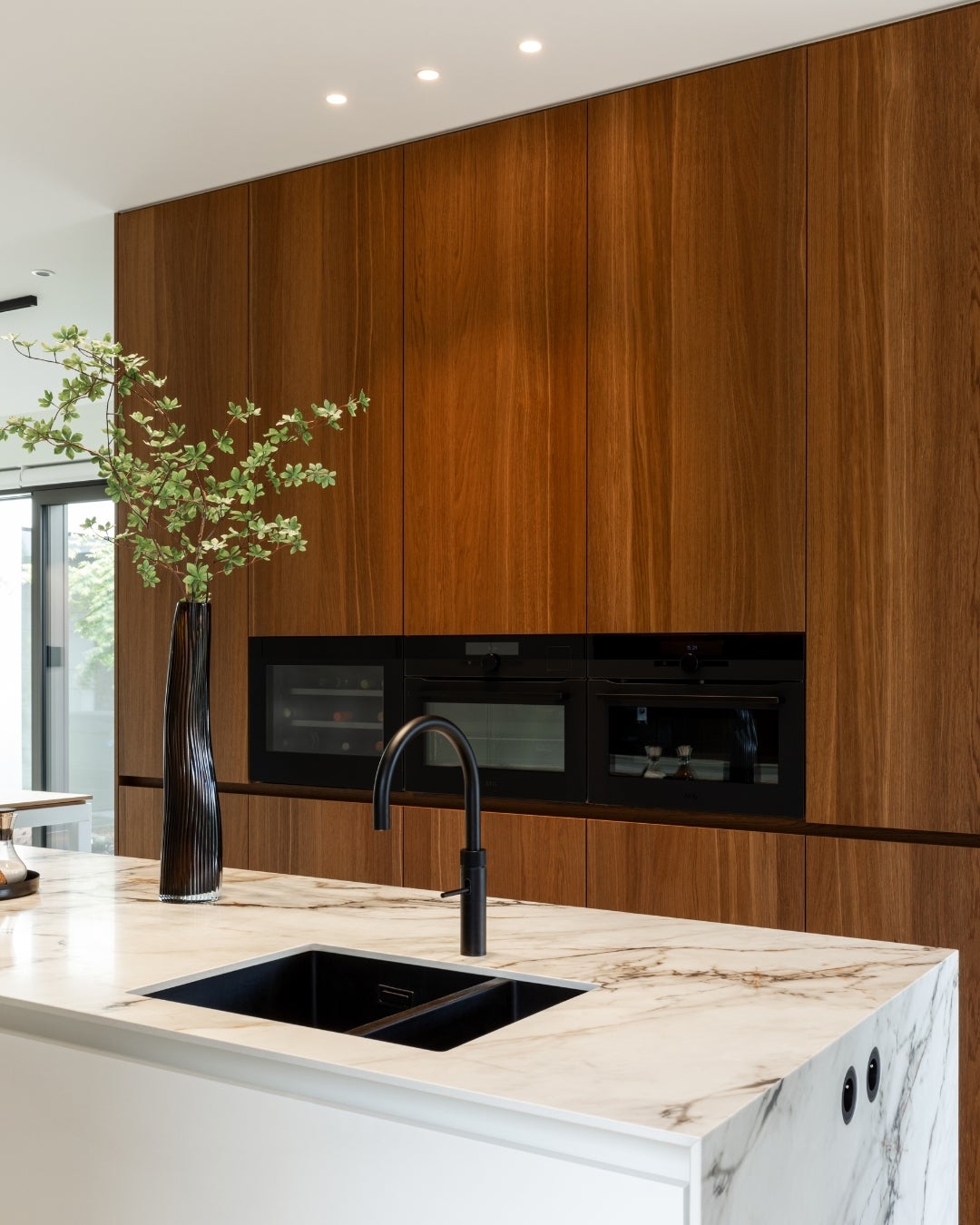 Kitchen design with Querkus smoked arabica wood veneer and marble - cabinetry - decospan