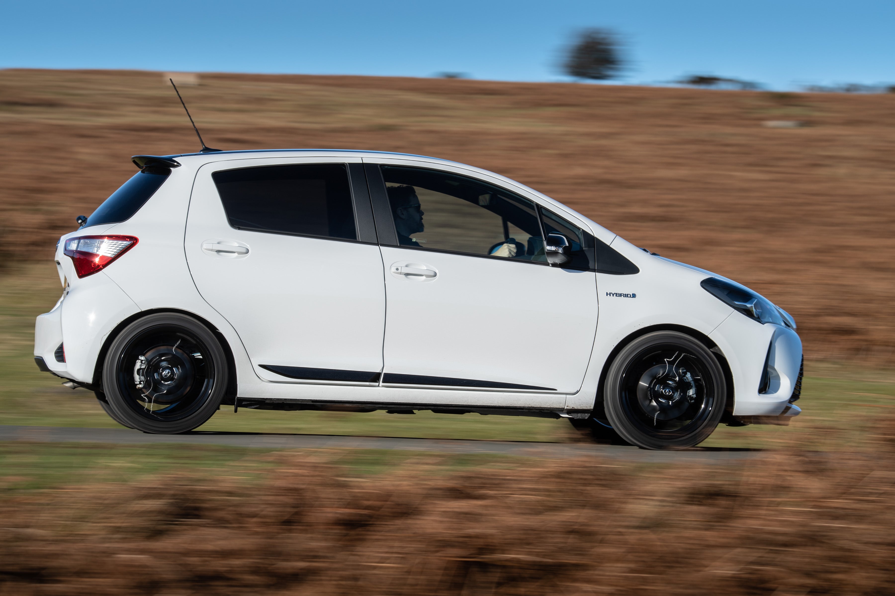 Toyota Yaris (2011-2020) Review: exterior side photo of the Toyota Yaris on the road