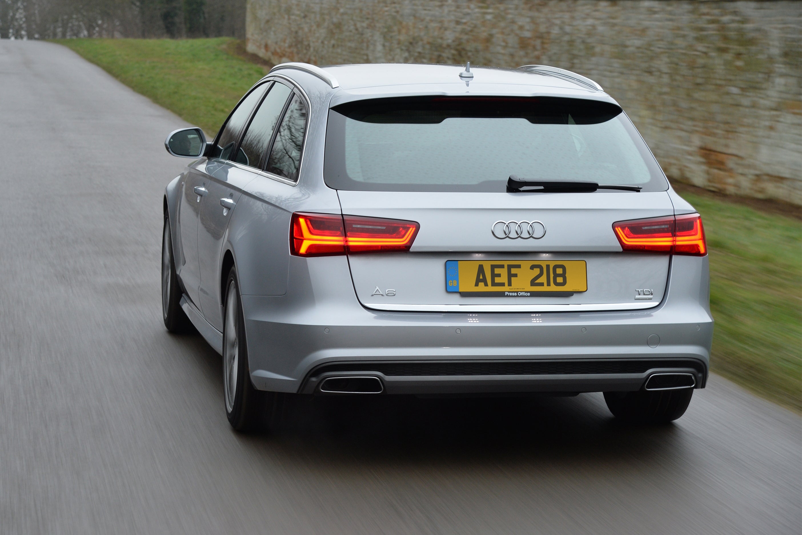 Audi A6 Avant (2011-2018) Review: exterior rear three quarter photo of the Audi A6 Avant on the road
