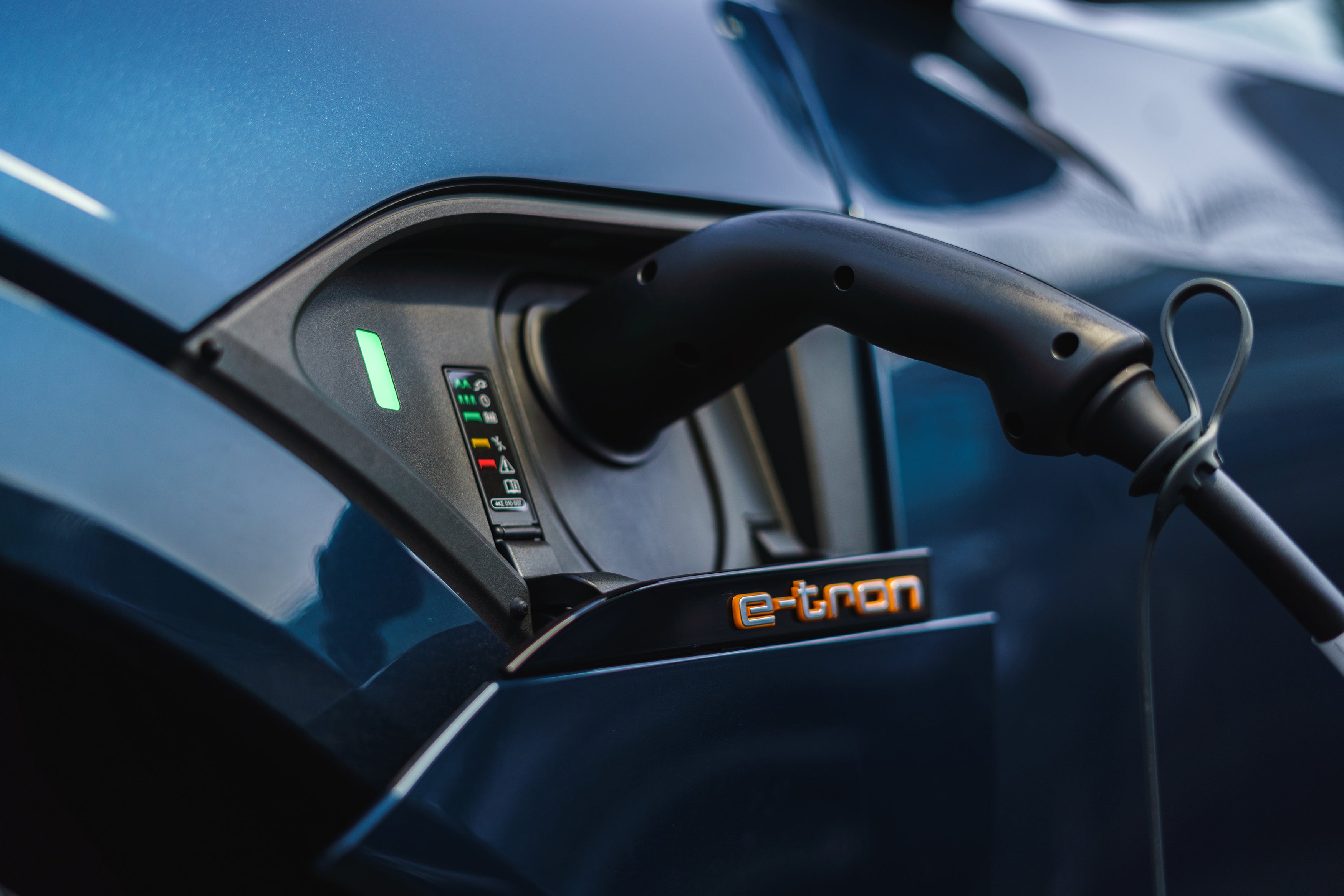 Audi e-tron (2019-2022) Review: exterior close up photo of the Audi e tron charging 