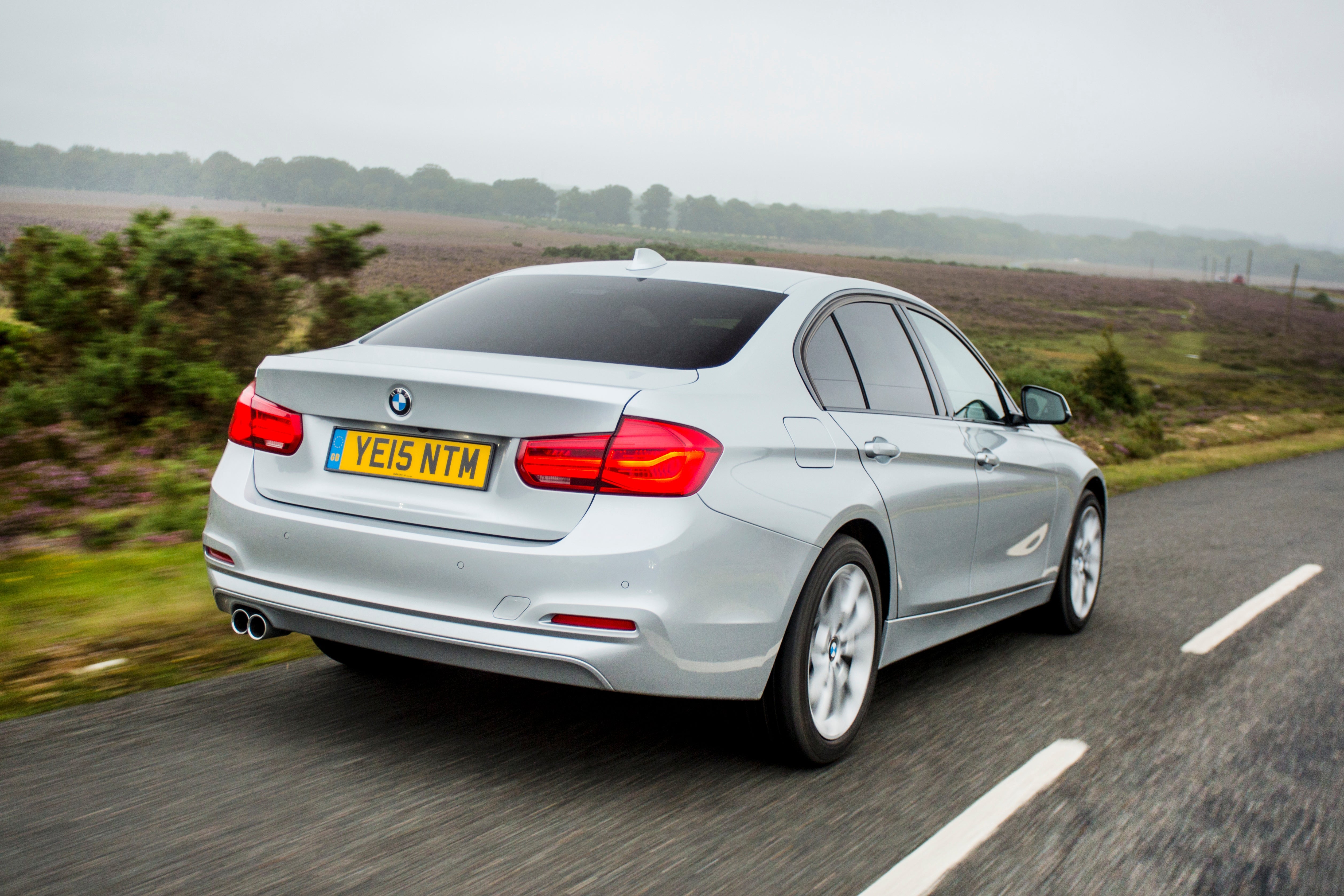 BMW 3 Series (2012-2018) Review: Exterior rear three quarter photo of the BMW 3 Series on the road
