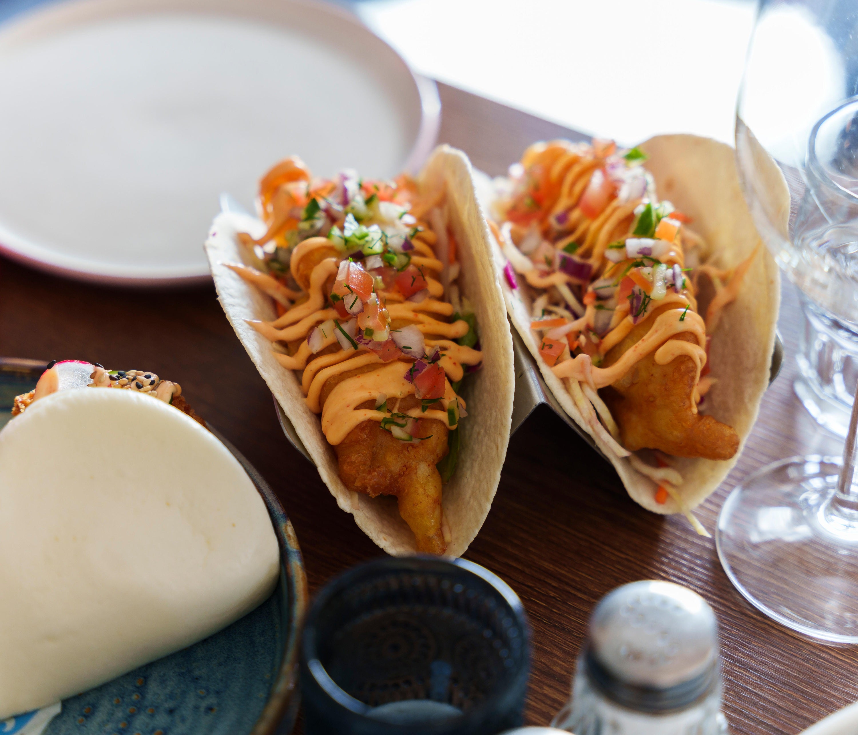 A group of tacos on a table