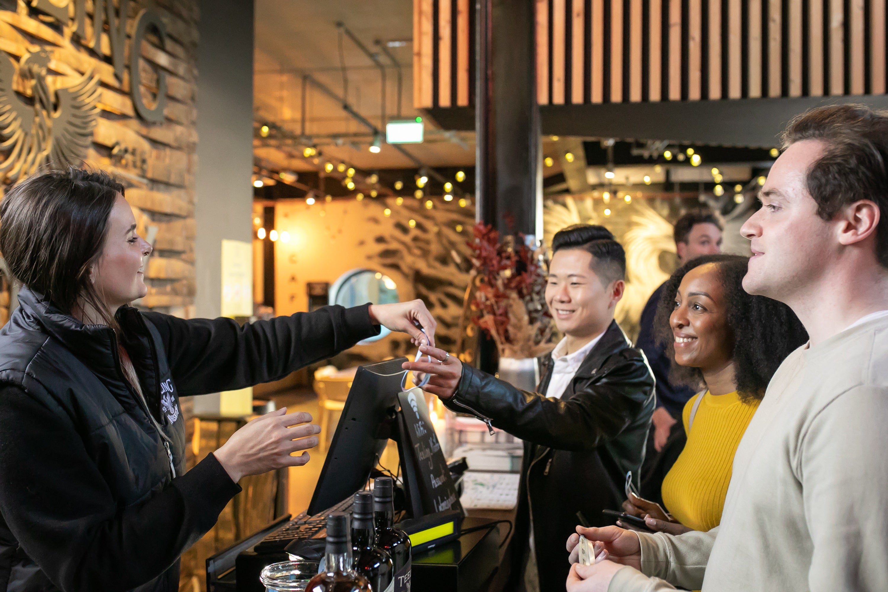 A man handing a card to a group of people