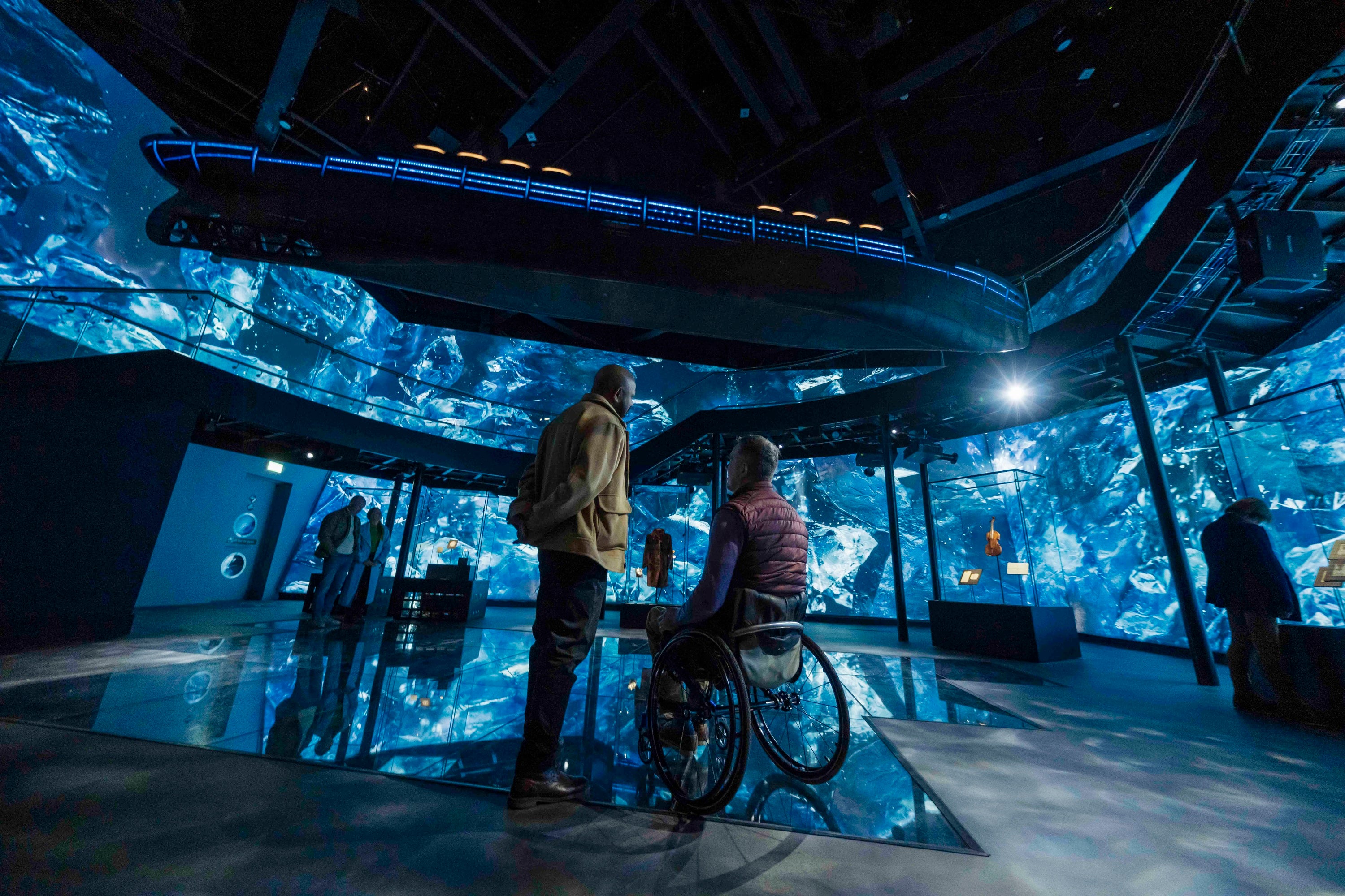 A man in a wheelchair looking at a man in a wheelchair