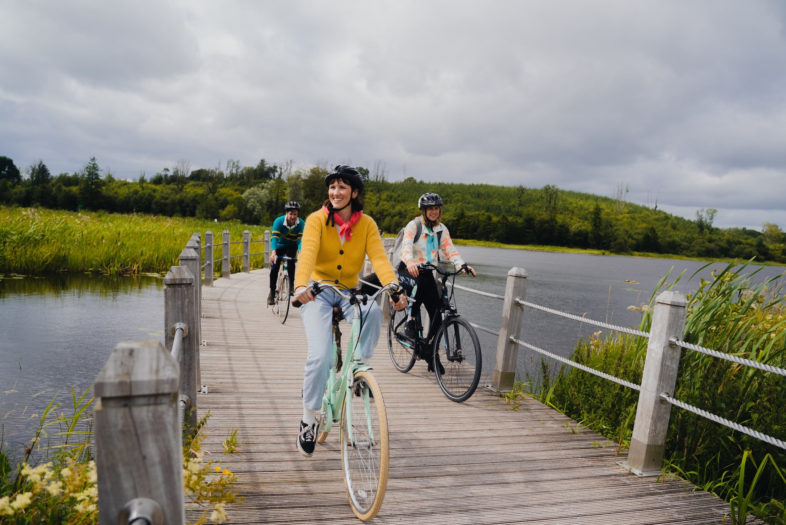 People cycling the Acres Lake Floating Boardwalk in Co Leitrim