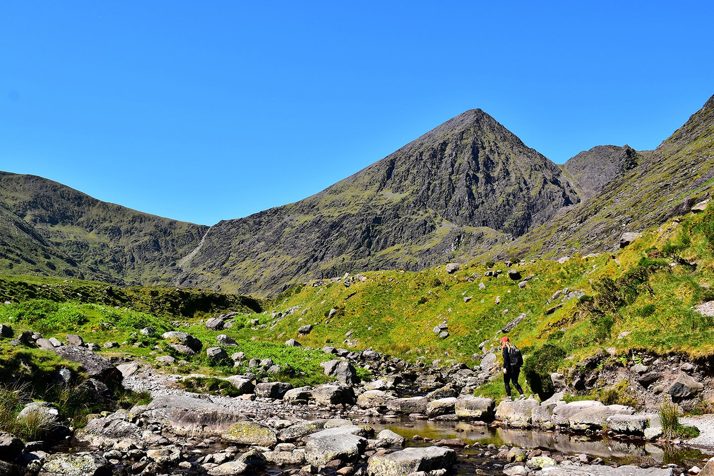 A hiker climbing Carrauntoohil in County Kerry