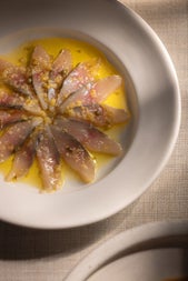 A dish from the menu at Comet plated up in the shape of a flower