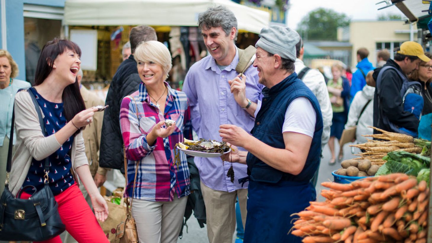 People enjoying some food at Galway's Farmers' Market