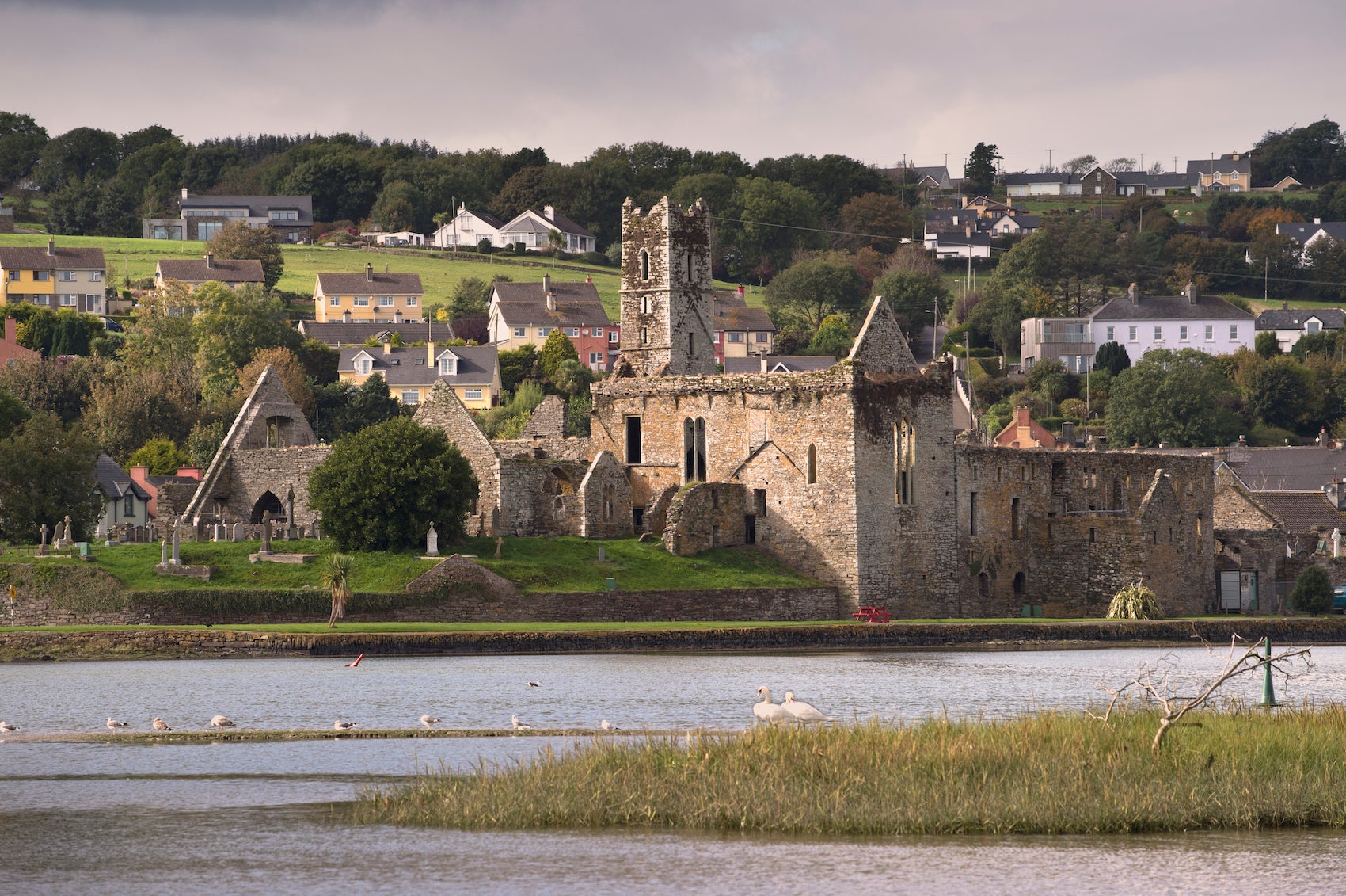 Distant image of Timoleague Abbey and the River Arigideen in County Cork.