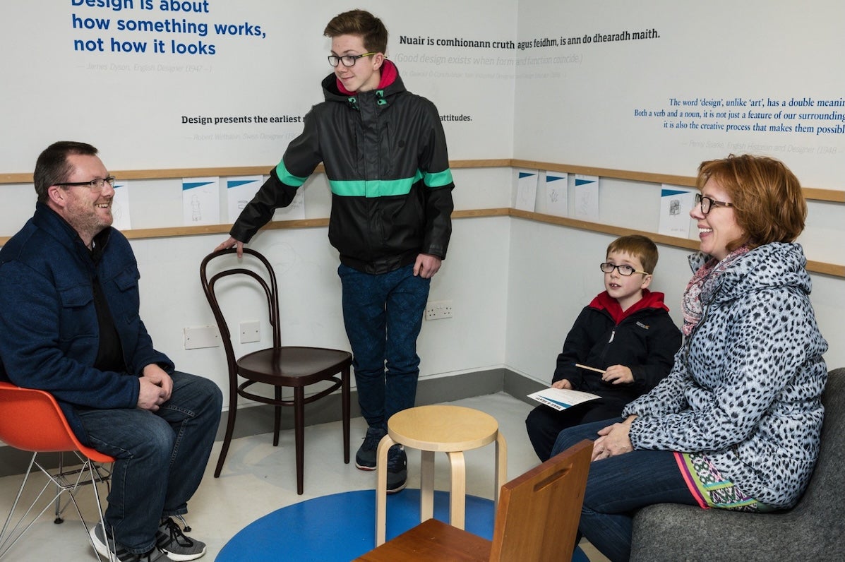 Image of a Family engaging with Take Your Seats gallery