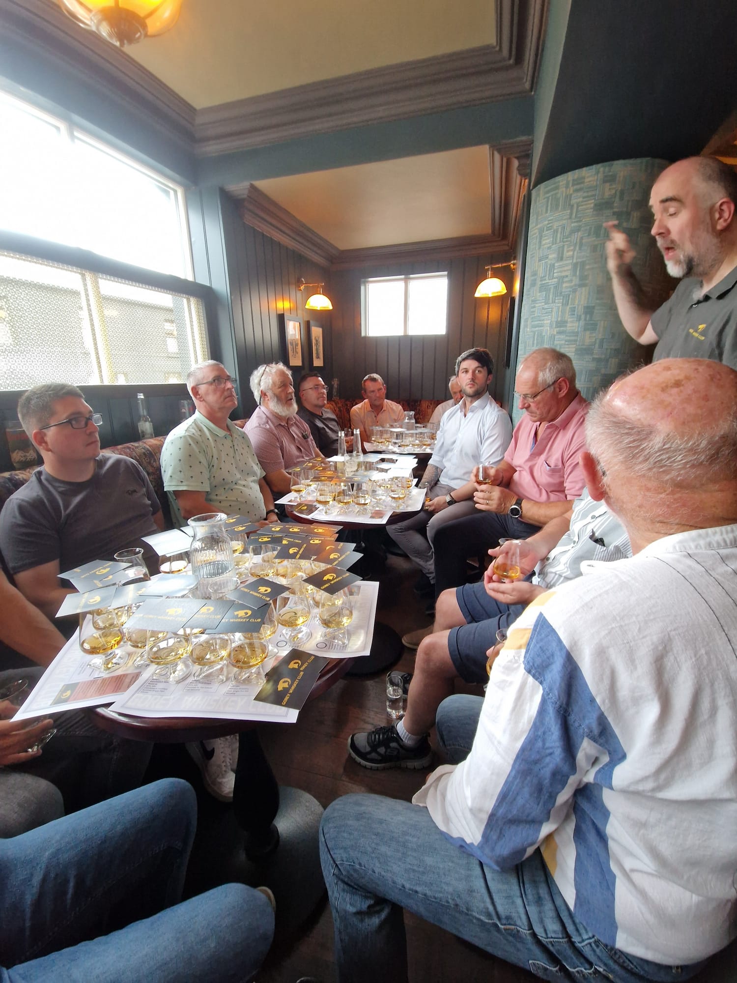A guided tasting in full flow at a Gorey Whiskey Club night. The festival brings eight ticketed sessions like this one to four venues across Gorey on 6 and 7 November 2026.