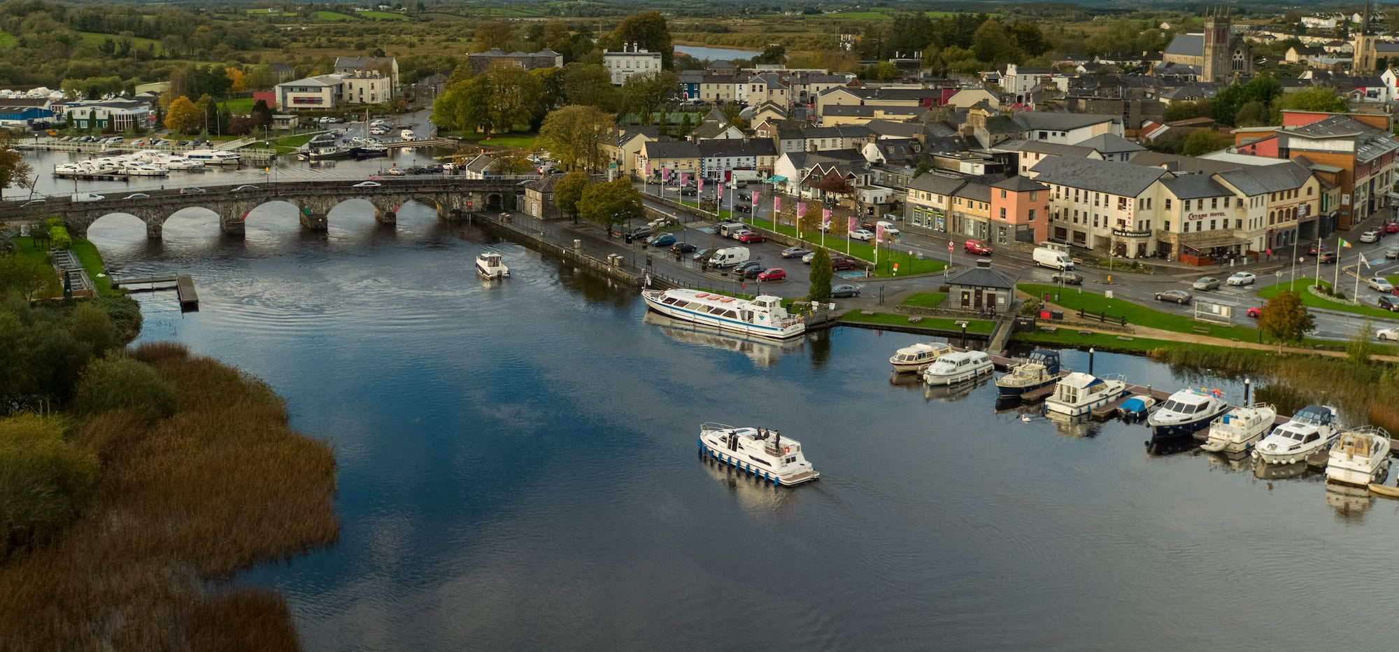 A boat cruising down the Carrick-on-Shannon in Co Leitrim
