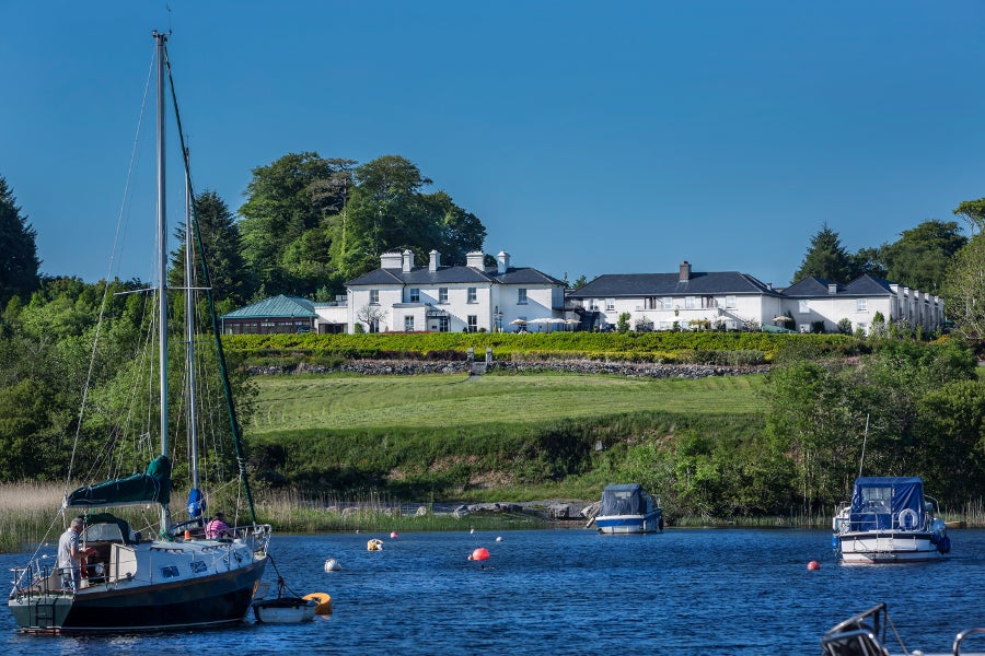 Water and boats with a view of the outside of the property