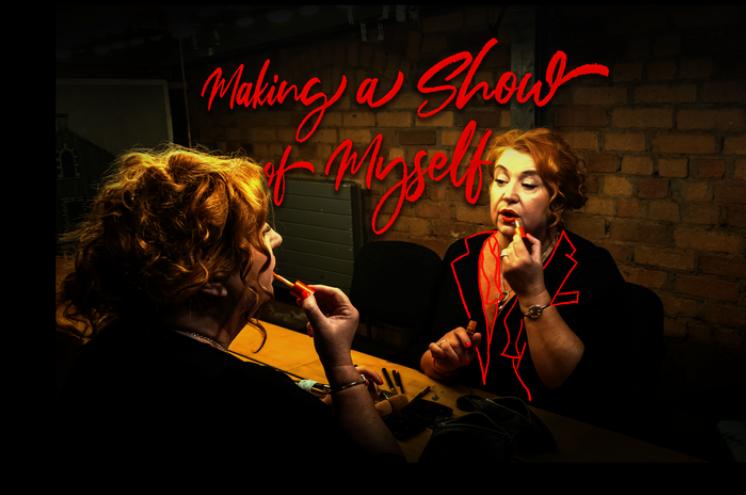 mary kate o flanagan in front of a dressing room mirror applying lipstick