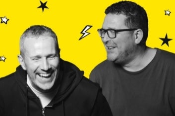 Black and white photo of 2 laughing men
