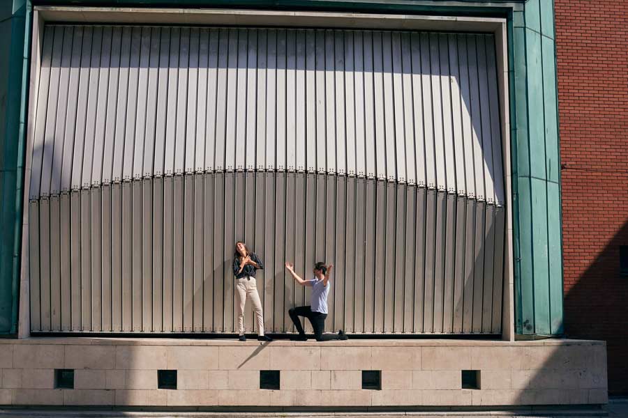Woman and a man acting out a scene