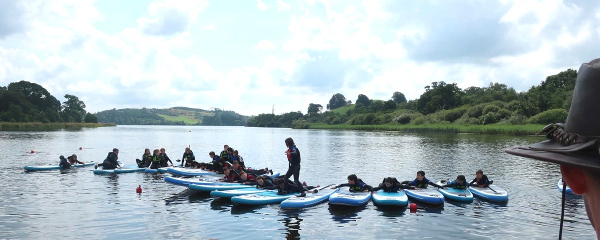 Paddlebaords lined up on the lake