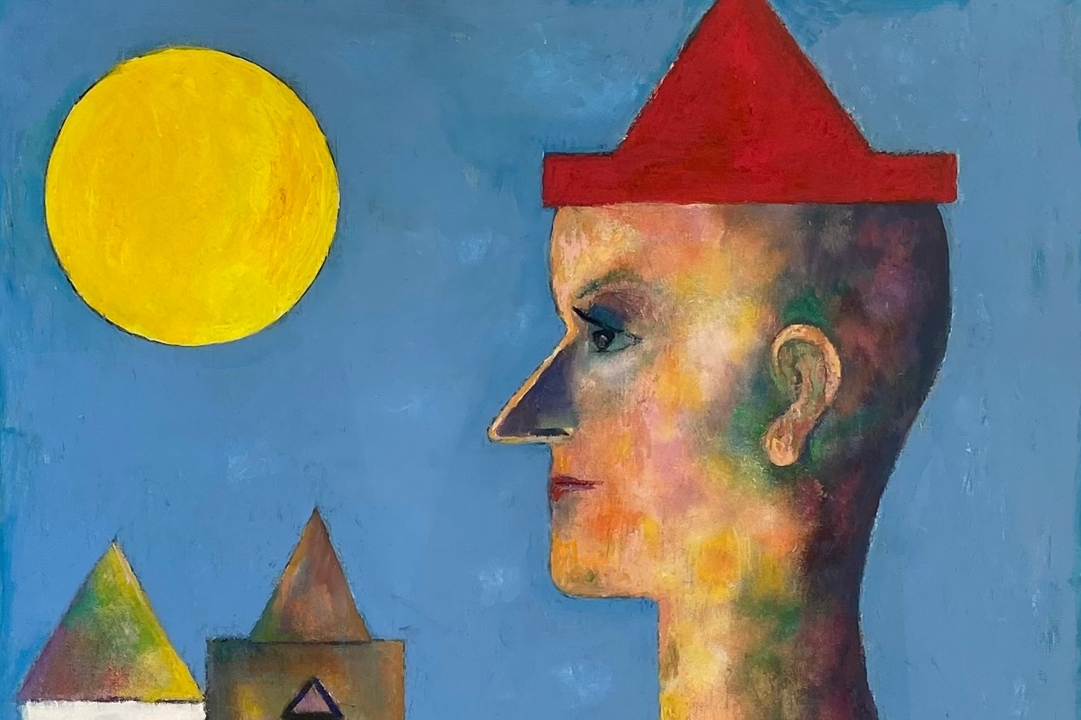 A contemplative clown stands in profile, dressed in a red hat and matching gown.