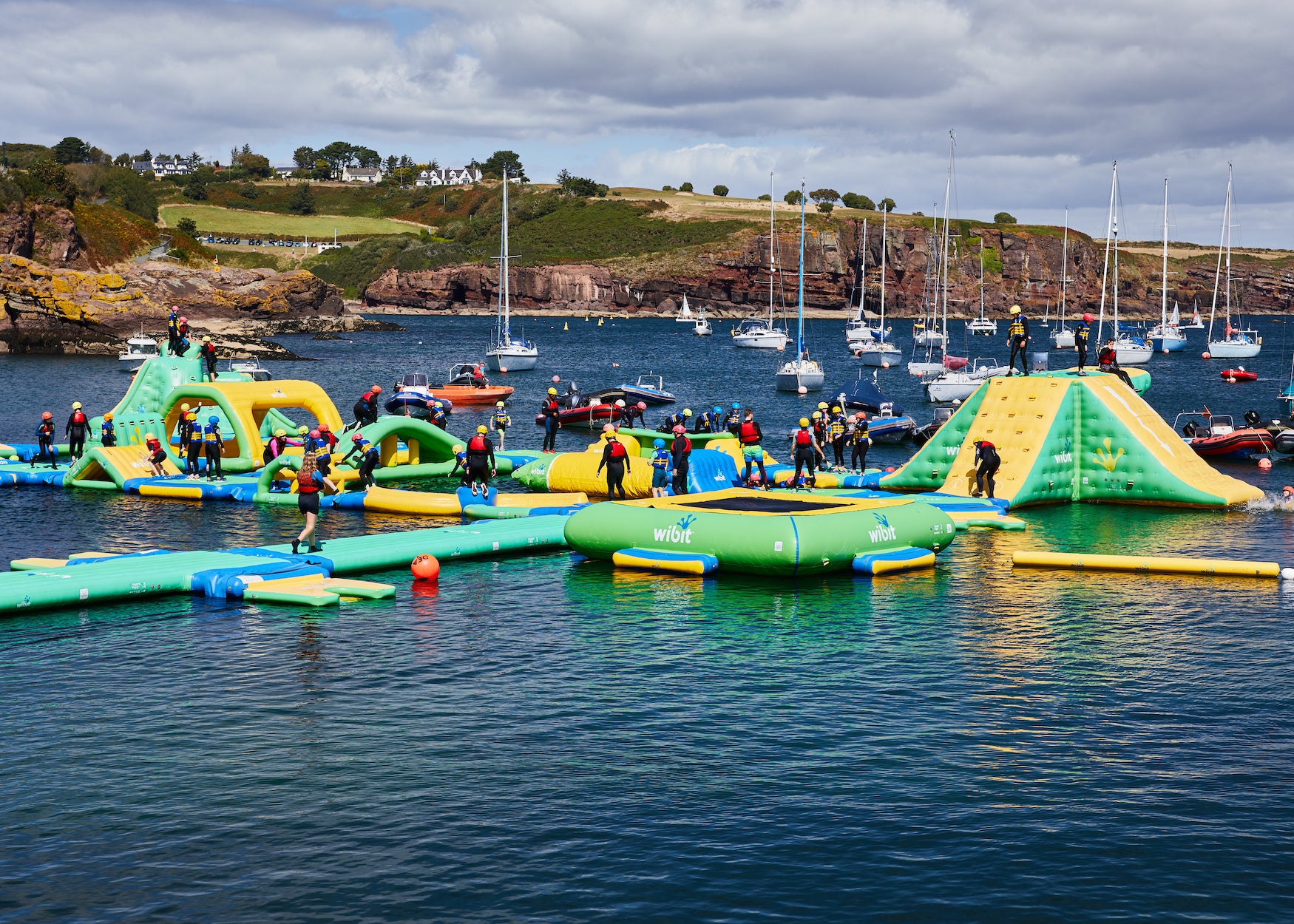 People on the inflatable obstacle course at Dunmore East Adventure Centre, Co Waterford