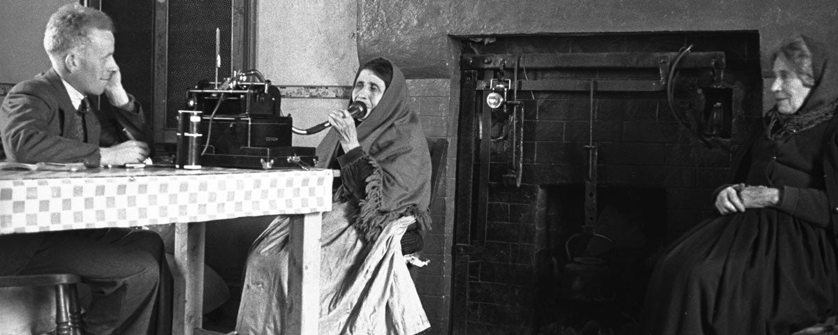 A gentleman taking voice recordings from two old ladies in Dunquin
