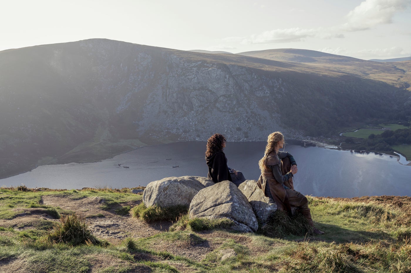 A scene from the tv series 'Vikings' showing two women looking down at Glendalough in county Wicklow.