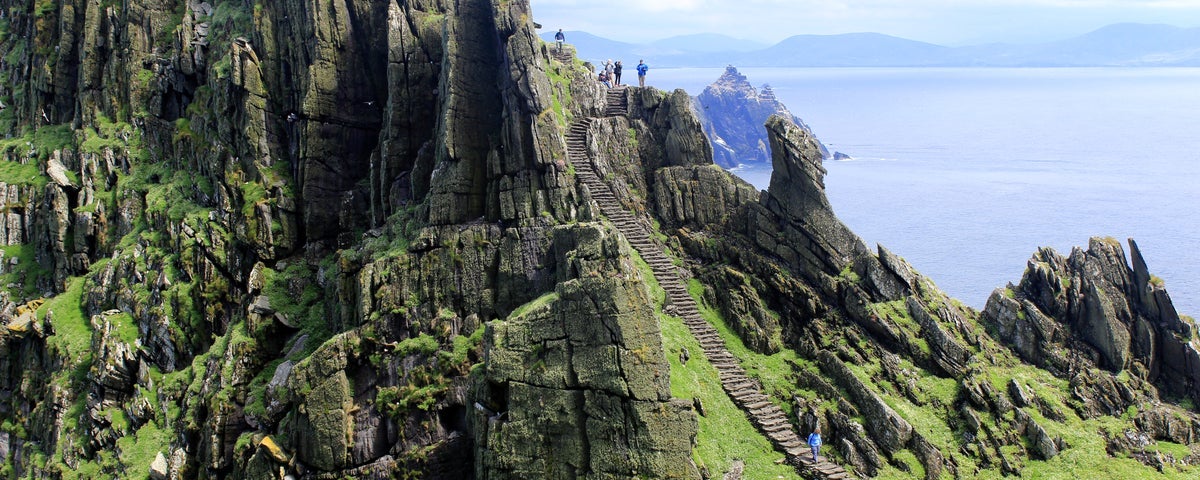 People climbing the steps on Skellig