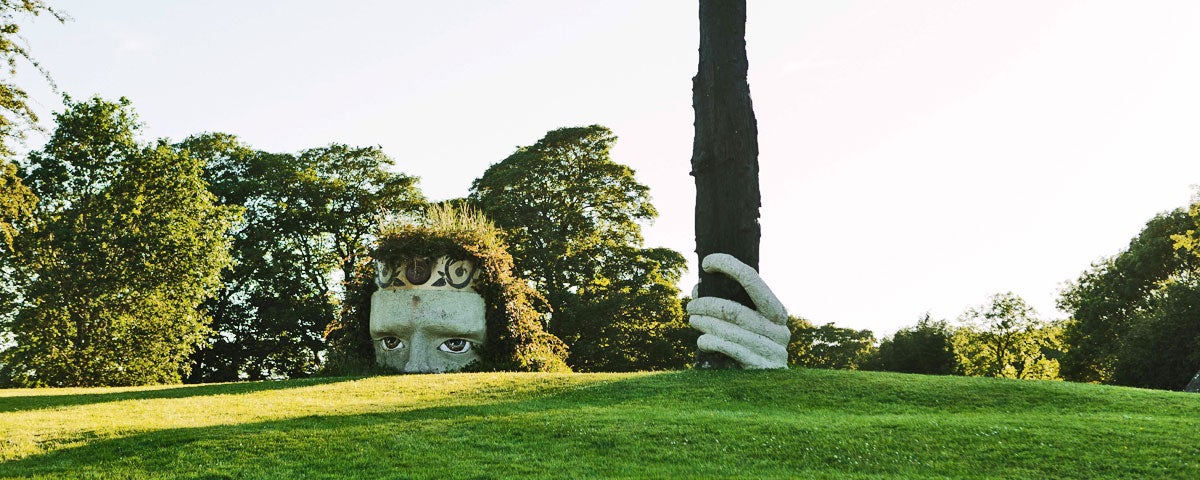 Dún na Sí Amenity and Heritage Park view of large ancient Celt head and hand sculpture