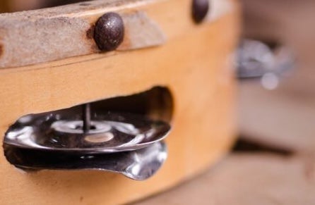 Close up view of the side of a tambourine.