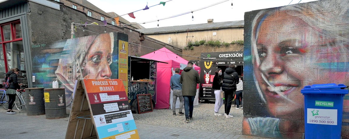 Phoenix Yard Market in Waterford, entrance with murals of two women