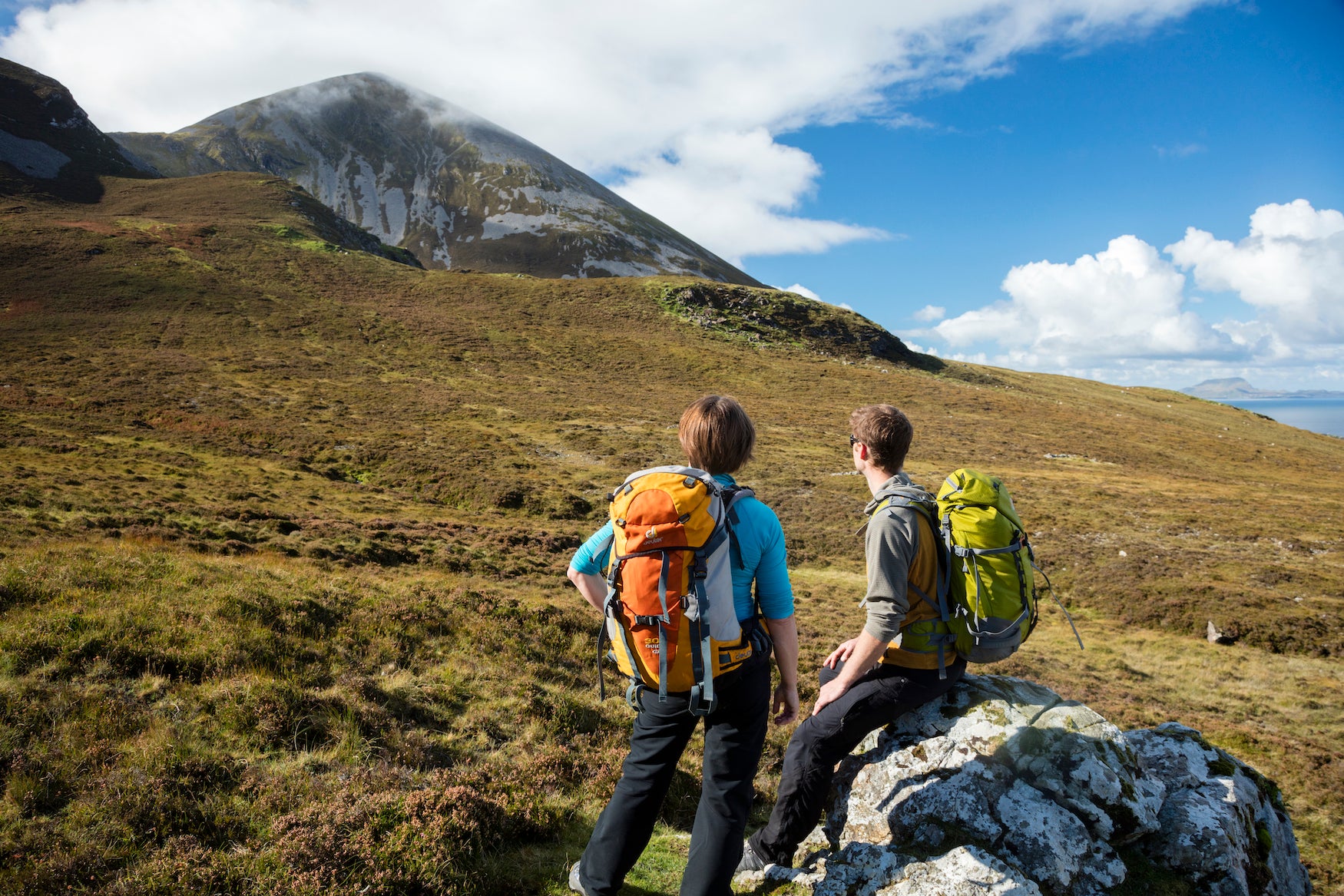 Two hikers looking at Croagh Patrick in County Mayo