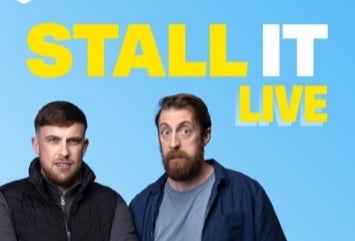 2 men standing, one looking suprised