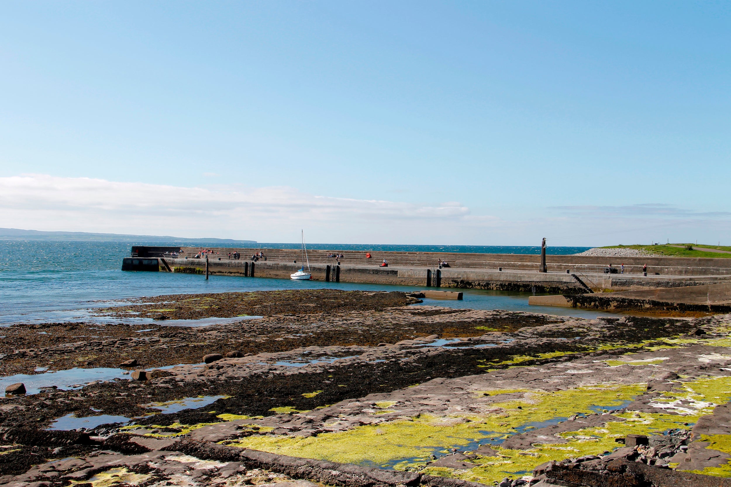 Inishcrone Pier in County Sligo on a sunny day.