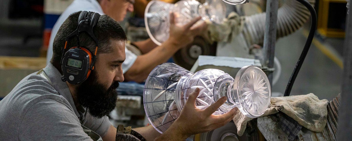 Craftsman working on a piece of Waterford crystal