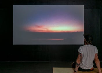 A man enjoys the Shahid Basil mixed media exhibition at The LAB Gallery