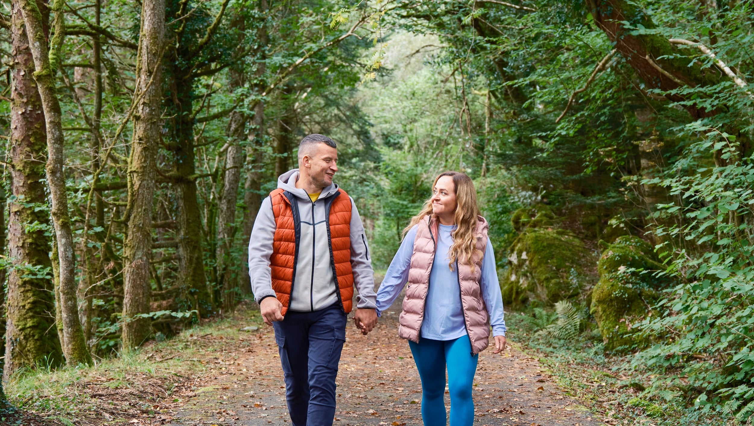 A couple walking the Connemara Greenway in Co Galway
