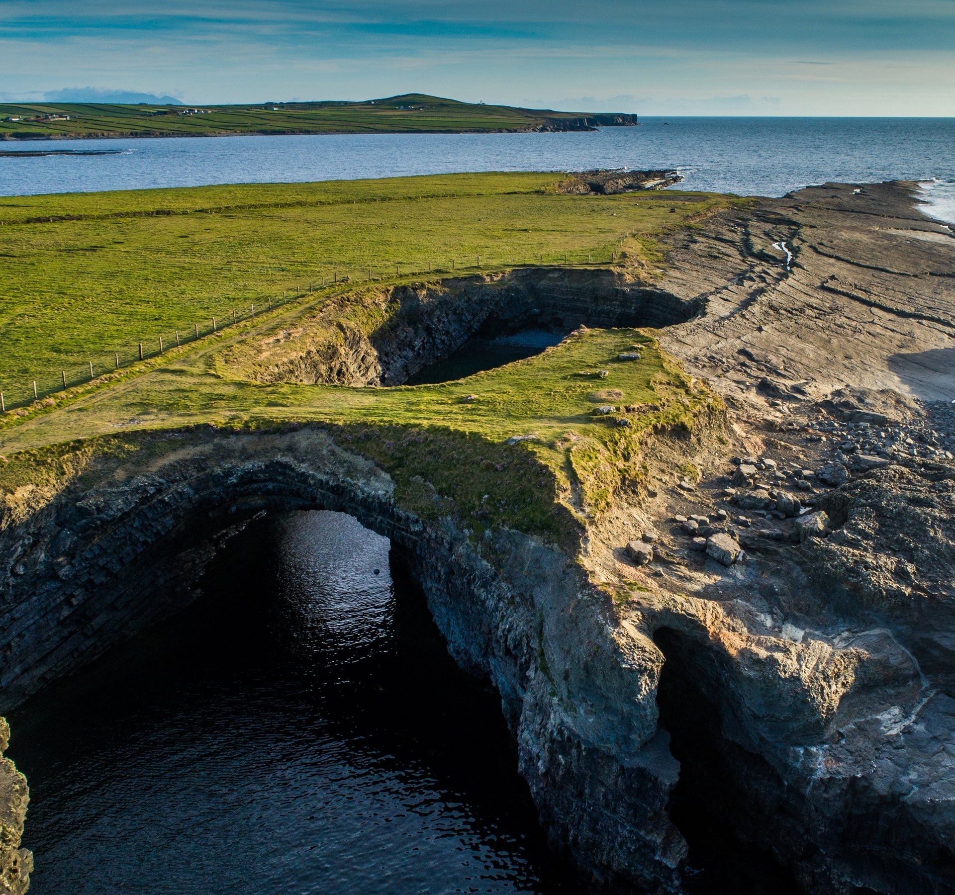 An aerial view of a sea cave at Loop Head Peninsula