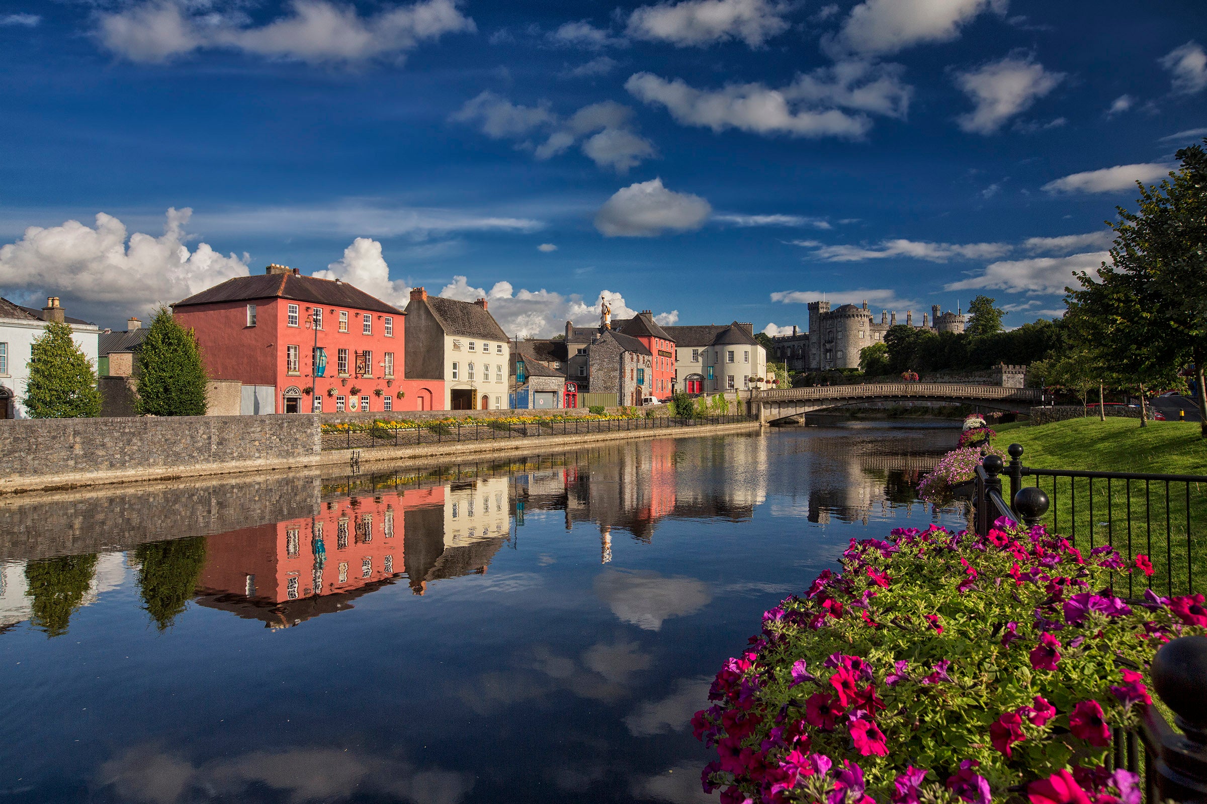 Reflections of colourful buildings on a river in Kilkenny City, Kilkenny