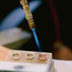 Three rings being soldered at Silverworks