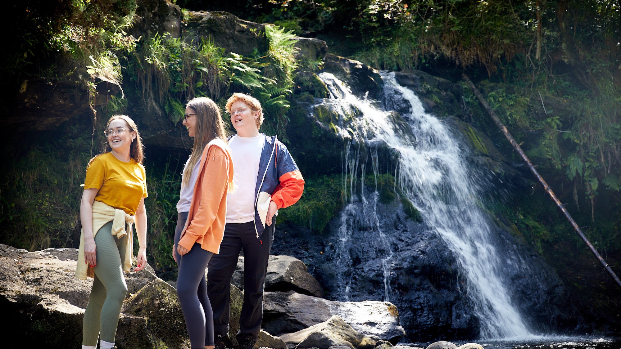 People standing by the waterfall on the Glenbarrow Eco Walk, Co Laois
