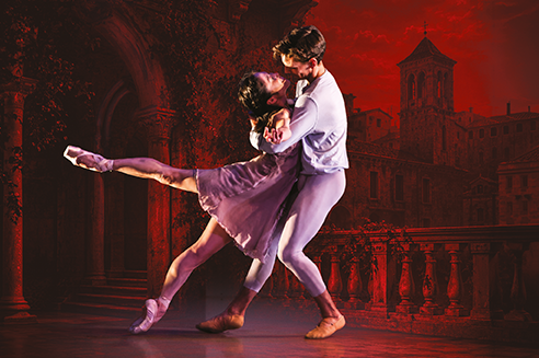 Romeo & Juliet ballet dancers embracing romantically