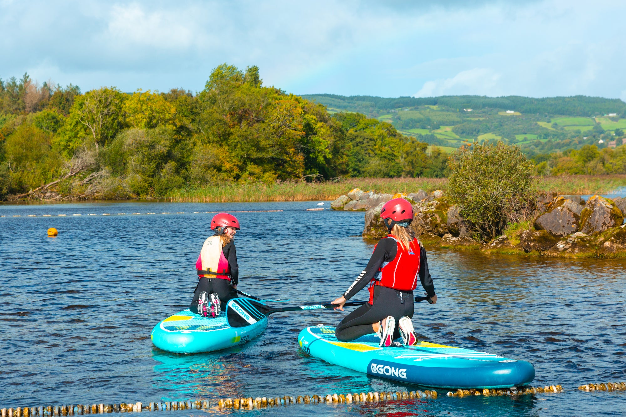 People paddle boarding at UL Sports Adventure Centre in County Clare