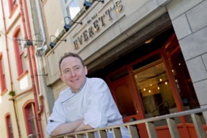 Chef standing outside the restaurant.