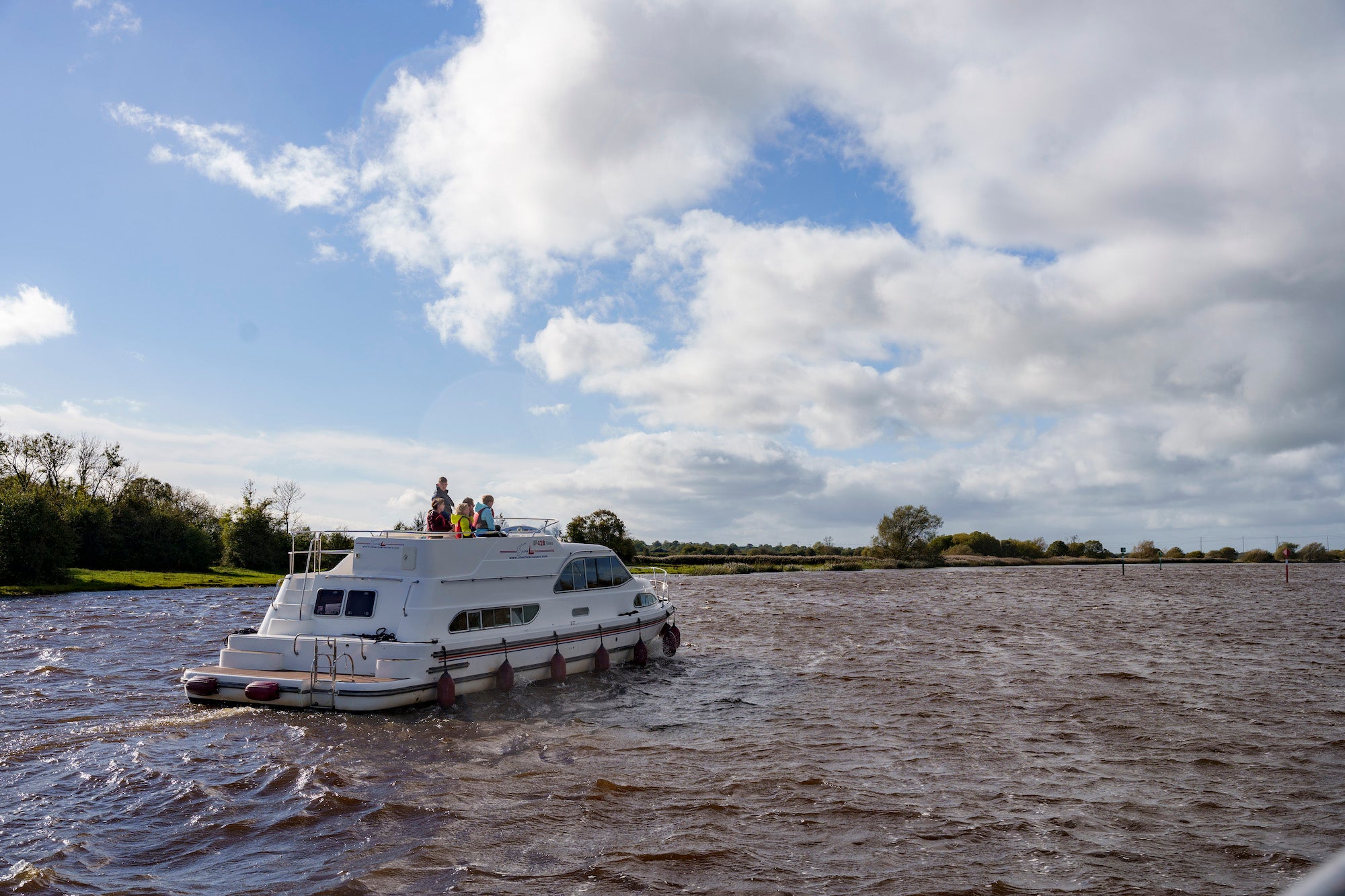 A family cruising the River Shannon in Banagher in Co Offaly
