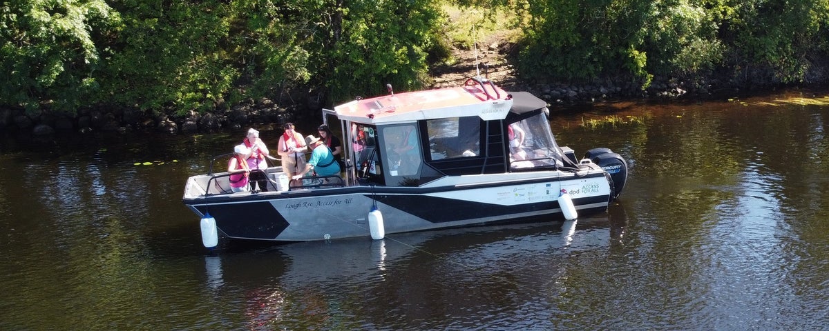 Passengers on a small boat enjoying a tour on a lake