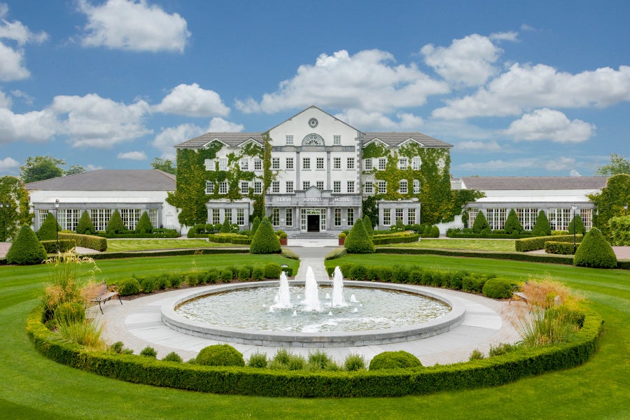 hotel exterior overlooking fountain and garden