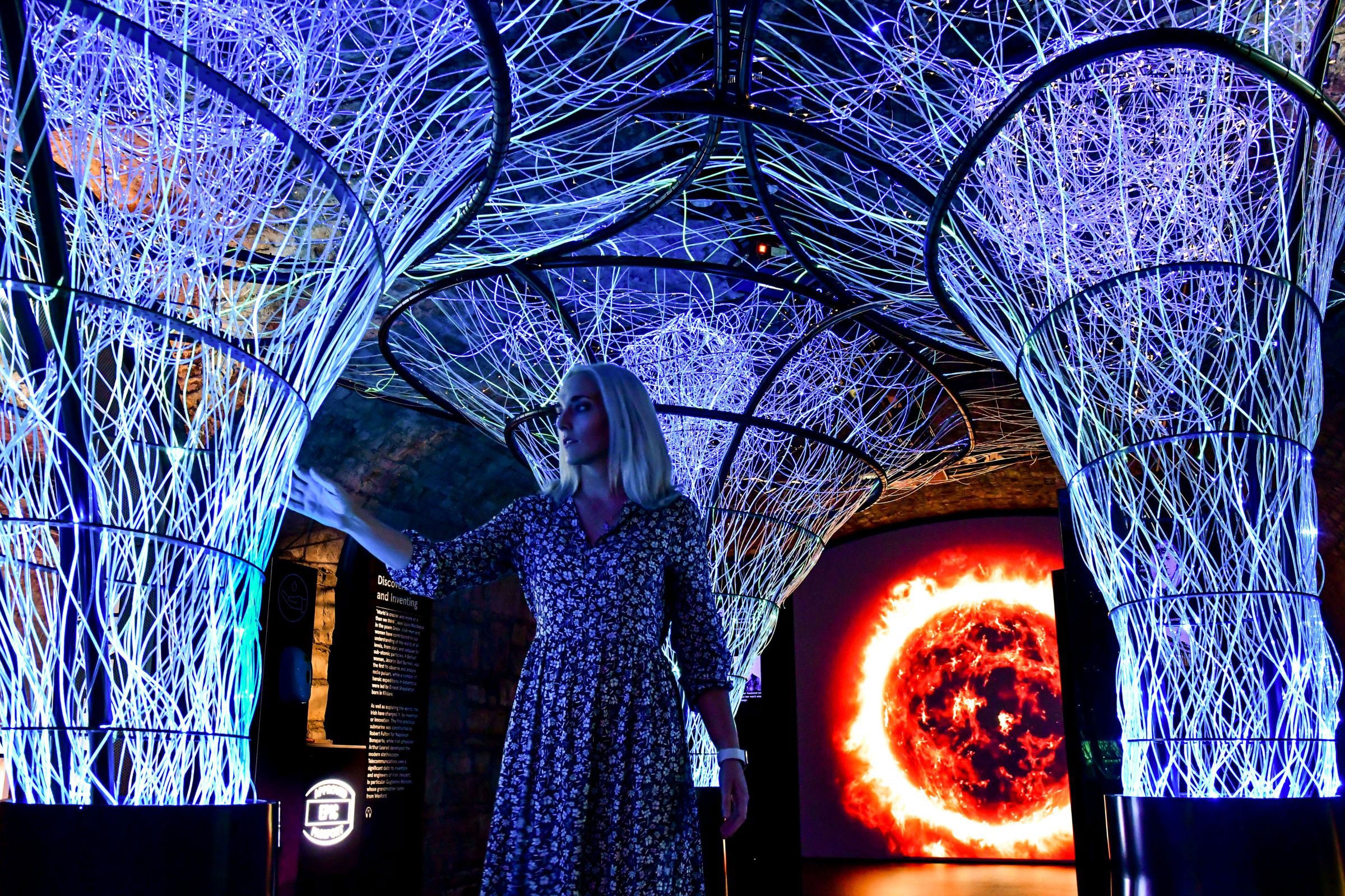 Woman viewing a light installation at EPIC