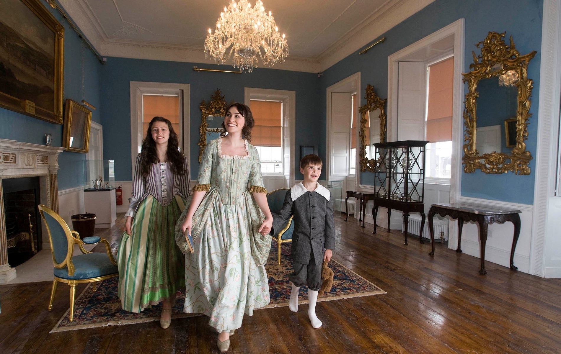 A family friendly tour inside The Bishop's Palace Museum with three kids dressed in costume