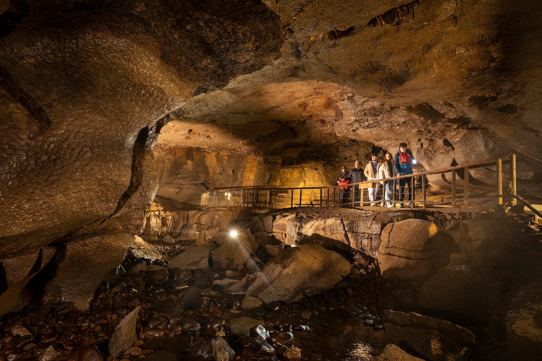 A family exploring the Marble Arch Caves