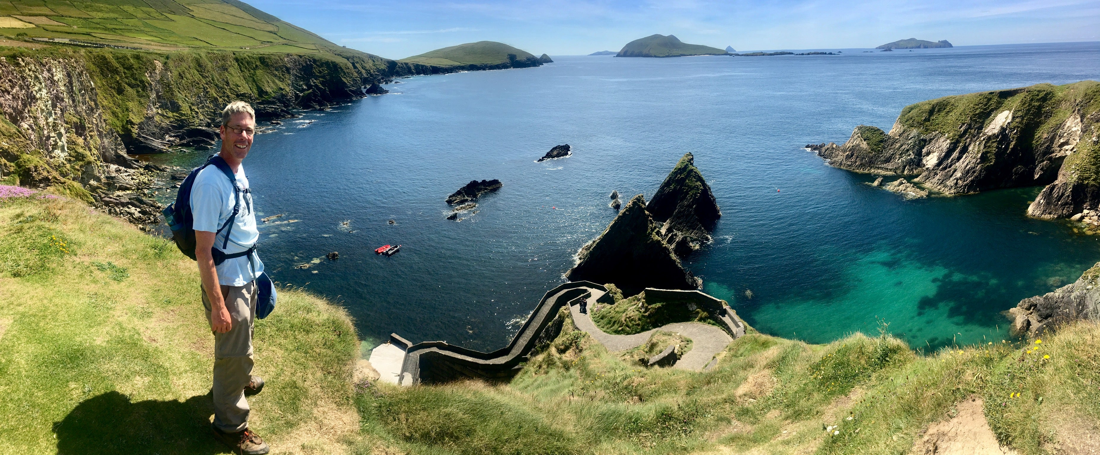 Man standing beside cliff edge 