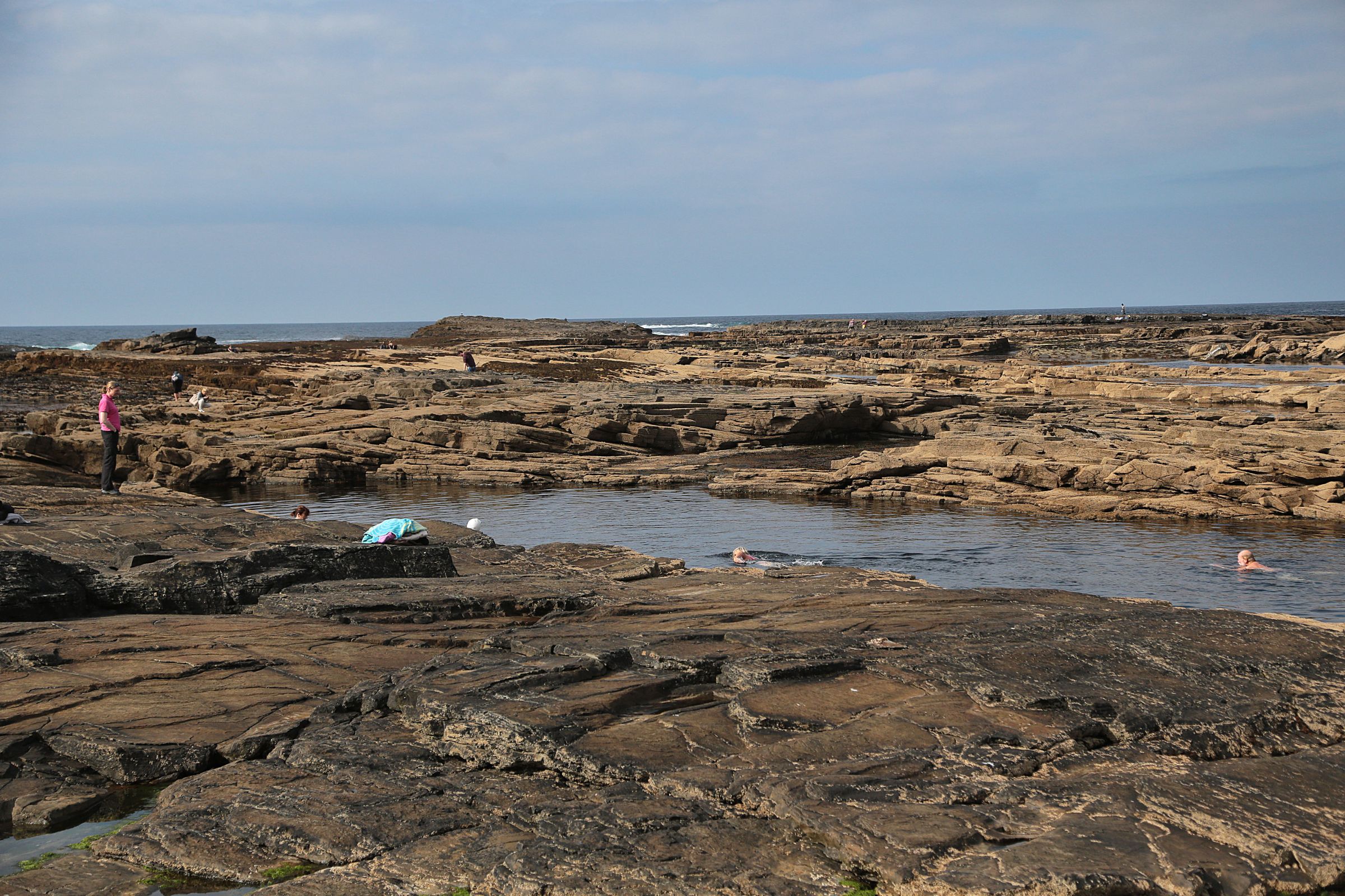 People swimming at the Pollock Holes, Kilkee, Co. Clare